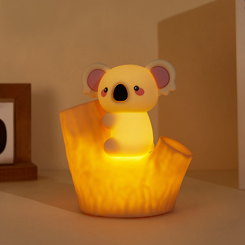Koala glow night light on a bedside shelf with warm light